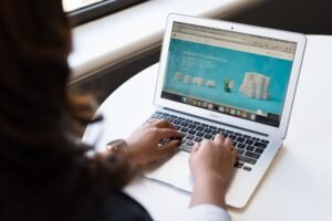 Templates Businesswoman working on laptop with Android 6.0 Marshmallow webpage open.